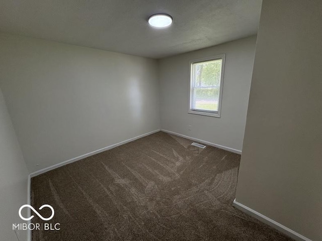 5725 N Clover Maple Dr, Fairland, IN 46126 - empty room with dark carpet and baseboards