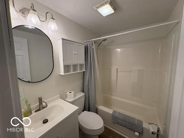 5725 N Clover Maple Dr, Fairland, IN 46126 - bathroom with shower / bath combo, vanity, a textured ceiling, and wood finished floors