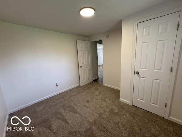 5725 N Clover Maple Dr, Fairland, IN 46126 - unfurnished bedroom featuring carpet and baseboards