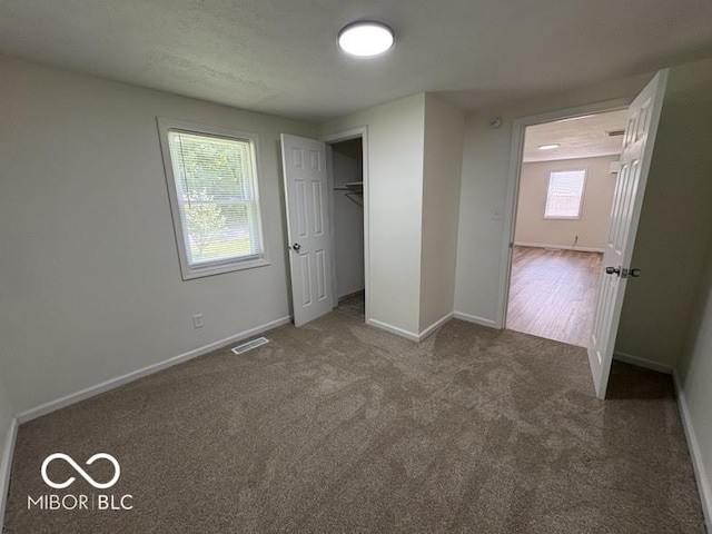 5725 N Clover Maple Dr, Fairland, IN 46126 - unfurnished bedroom featuring carpet flooring and a closet