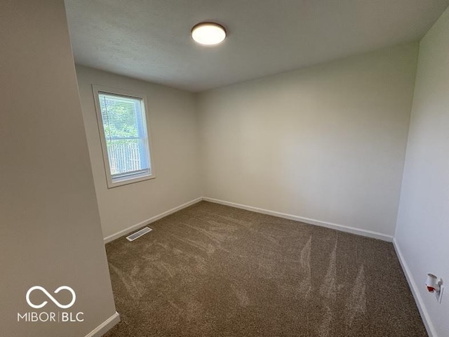 5725 N Clover Maple Dr, Fairland, IN 46126 - spare room featuring dark colored carpet