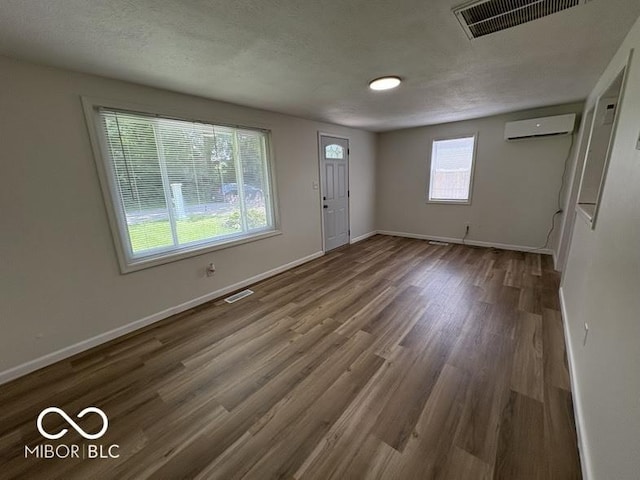 5725 N Clover Maple Dr, Fairland, IN 46126 - foyer entrance featuring wood finished floors and an AC wall unit