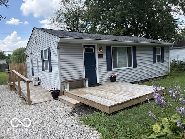 5725 N Clover Maple Dr, Fairland, IN 46126 - rear view of property featuring a deck and roof with shingles