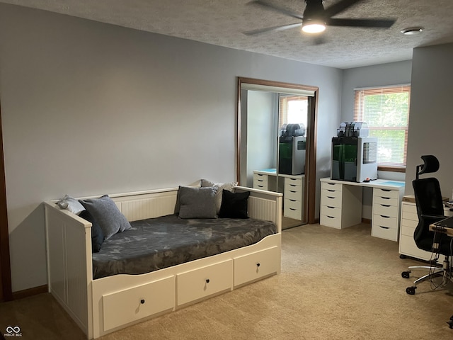 19938 State Road 37 N, Noblesville, IN 46060 - bedroom featuring light colored carpet, a desk, a textured ceiling, and a ceiling fan
