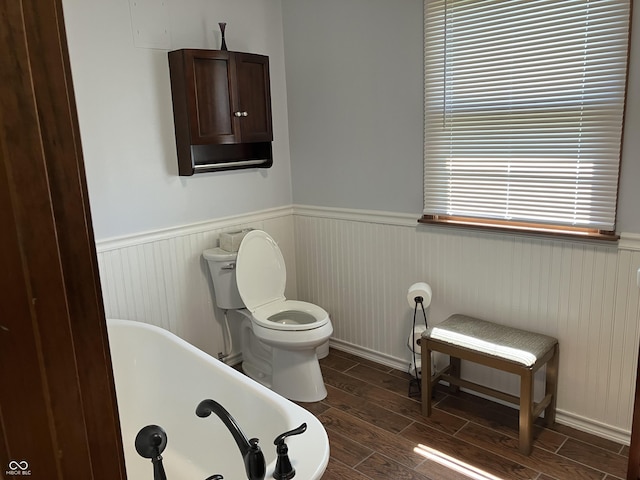 19938 State Road 37 N, Noblesville, IN 46060 - full bathroom with a freestanding tub, a wainscoted wall, and wood finished floors