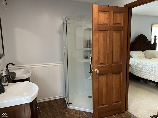 19938 State Road 37 N, Noblesville, IN 46060 - ensuite bathroom featuring a stall shower, wainscoting, and wood finished floors
