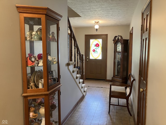 19938 State Road 37 N, Noblesville, IN 46060 - tiled foyer entrance featuring stairway and a textured ceiling