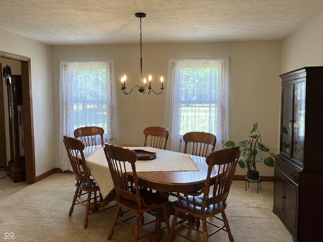 19938 State Road 37 N, Noblesville, IN 46060 - dining area featuring plenty of natural light, light colored carpet, a chandelier, and a textured ceiling