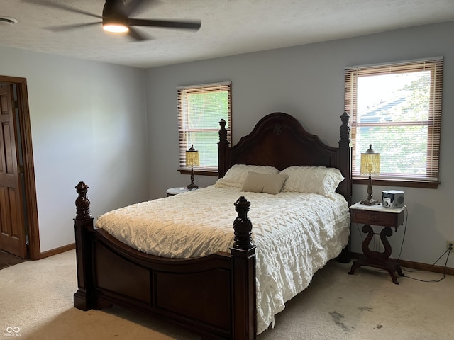19938 State Road 37 N, Noblesville, IN 46060 - bedroom featuring light colored carpet, multiple windows, and a ceiling fan