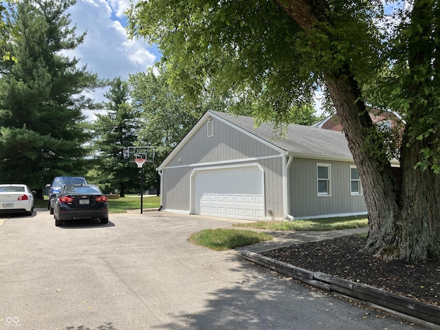 19938 State Road 37 N, Noblesville, IN 46060 - view of side of home featuring roof with shingles and an attached garage