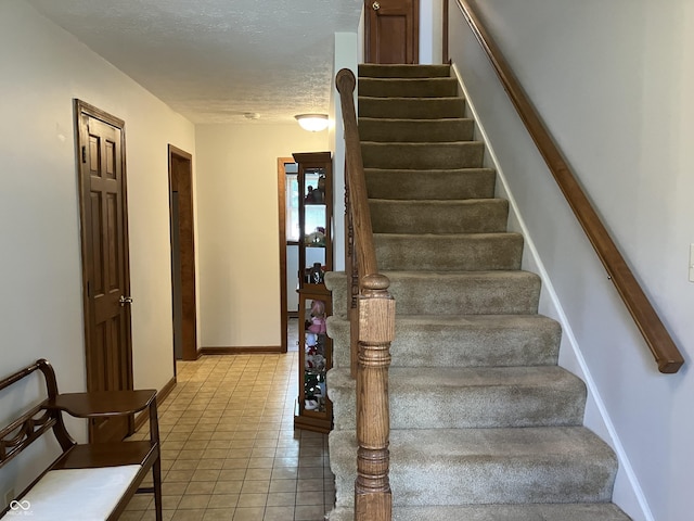 19938 State Road 37 N, Noblesville, IN 46060 - stairs with tile patterned floors and a textured ceiling