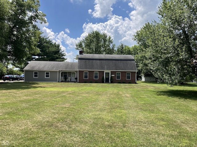 19938 State Road 37 N, Noblesville, IN 46060 - view of front facade featuring brick siding, a front lawn, a chimney, and roof with shingles