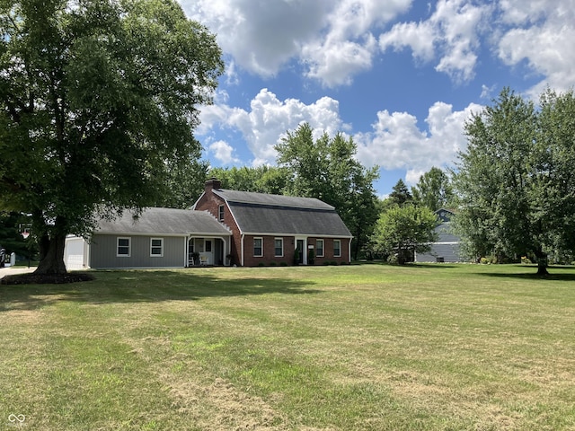 19938 State Road 37 N, Noblesville, IN 46060 - back of house featuring a yard, a chimney, a garage, and brick siding