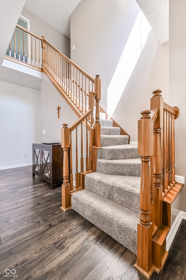 7611 Prairie Fire Ct, Brownsburg, IN 46112 - staircase featuring wood finished floors and a skylight