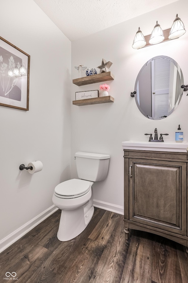 7611 Prairie Fire Ct, Brownsburg, IN 46112 - bathroom with wood finished floors, vanity, and a textured ceiling