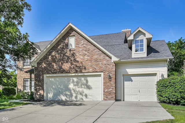 7611 Prairie Fire Ct, Brownsburg, IN 46112 - traditional-style home with brick siding, driveway, an attached garage, and a chimney