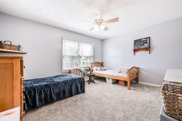 7611 Prairie Fire Ct, Brownsburg, IN 46112 - bedroom featuring carpet floors, a textured ceiling, and a ceiling fan