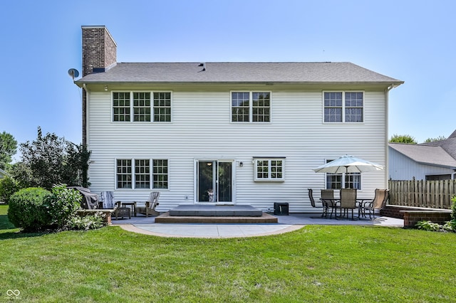 7611 Prairie Fire Ct, Brownsburg, IN 46112 - back of property featuring a patio area and a chimney