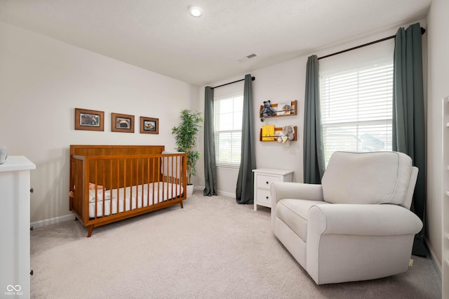 12888 Girvan Way, Fishers, IN 46037 - bedroom featuring a crib and light colored carpet