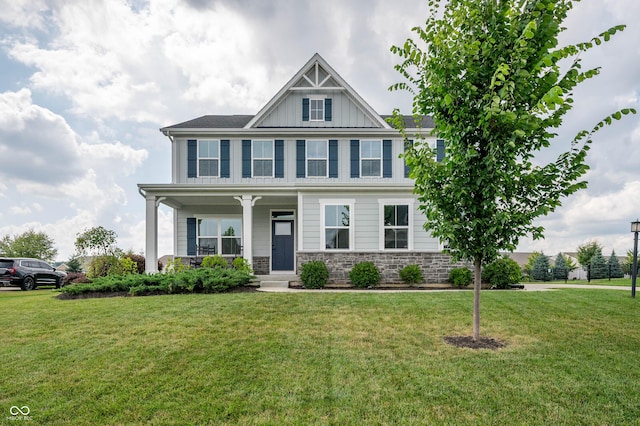 12888 Girvan Way, Fishers, IN 46037 - craftsman inspired home with covered porch, a front lawn, board and batten siding, and stone siding