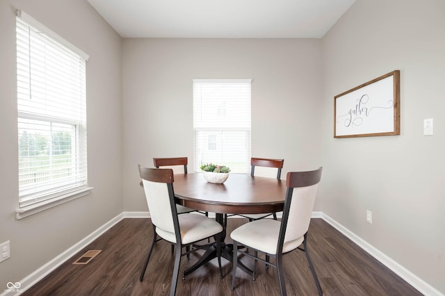 12888 Girvan Way, Fishers, IN 46037 - dining room with dark wood-style flooring and baseboards