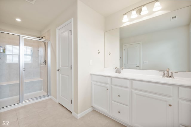 12888 Girvan Way, Fishers, IN 46037 - full bath featuring a stall shower, double vanity, and tile patterned floors