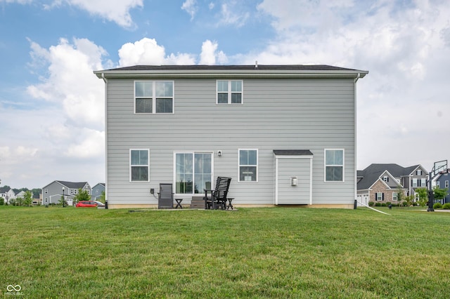 12888 Girvan Way, Fishers, IN 46037 - back of house with a yard, a residential view, and a patio