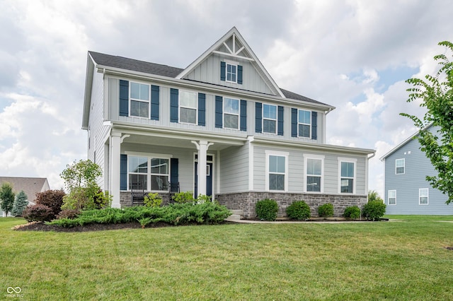 12888 Girvan Way, Fishers, IN 46037 - view of front of home with board and batten siding, a front lawn, stone siding, and a porch