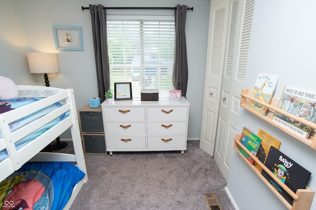6118 Thrushwood Cir, Indianapolis, IN 46250 - carpeted bedroom featuring a closet and multiple windows