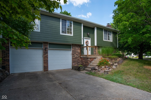 6118 Thrushwood Cir, Indianapolis, IN 46250 - bi-level home featuring concrete driveway, a garage, brick siding, a chimney, and a front lawn