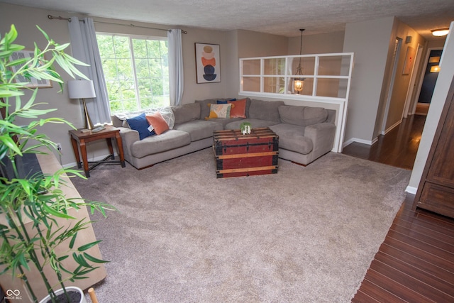 6118 Thrushwood Cir, Indianapolis, IN 46250 - living room featuring dark wood-type flooring and a textured ceiling