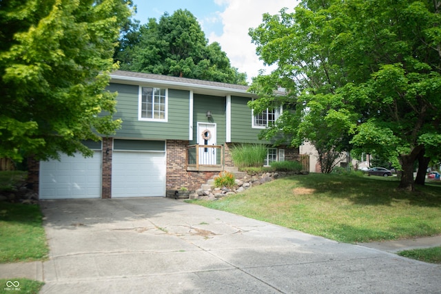 6118 Thrushwood Cir, Indianapolis, IN 46250 - raised ranch featuring brick siding, driveway, an attached garage, and a front yard