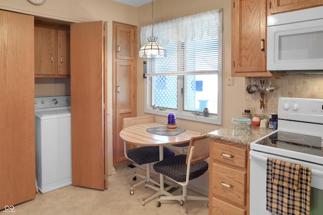 6880 S 850 E, Zionsville, IN 46077 - kitchen with white appliances, washer / dryer, backsplash, decorative light fixtures, and light stone counters