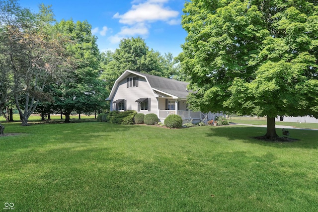 6880 S 850 E, Zionsville, IN 46077 - view of front of property featuring a gambrel roof, covered porch, and a front yard