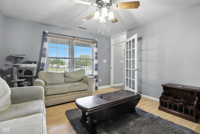 8321 Giroud Way, Indianapolis, IN 46259 - living room with wood finished floors, a ceiling fan, and french doors