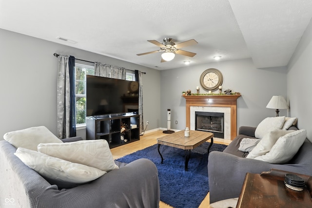 8321 Giroud Way, Indianapolis, IN 46259 - living room featuring wood finished floors, a ceiling fan, and a fireplace