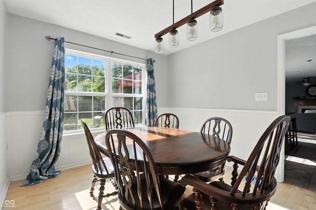 8321 Giroud Way, Indianapolis, IN 46259 - dining area with a wainscoted wall and light wood-style floors