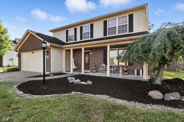 8321 Giroud Way, Indianapolis, IN 46259 - traditional-style house featuring a porch, brick siding, an attached garage, and concrete driveway