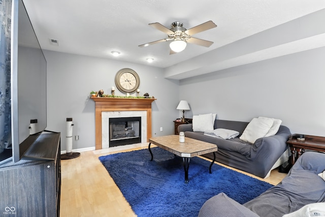 8321 Giroud Way, Indianapolis, IN 46259 - living area featuring ceiling fan, wood finished floors, and a fireplace with flush hearth