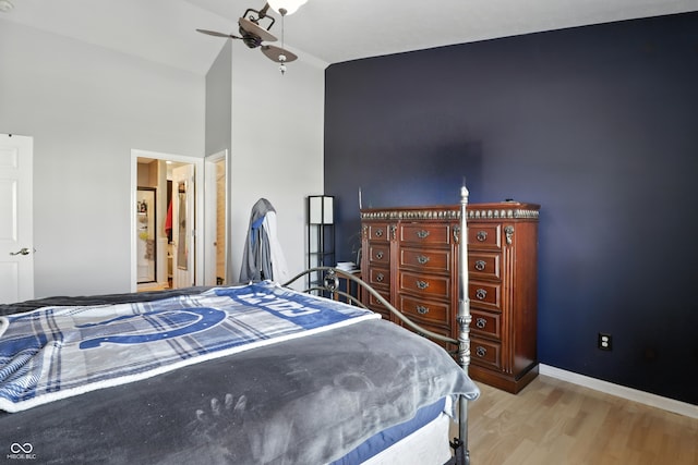 8321 Giroud Way, Indianapolis, IN 46259 - bedroom with light wood finished floors and high vaulted ceiling