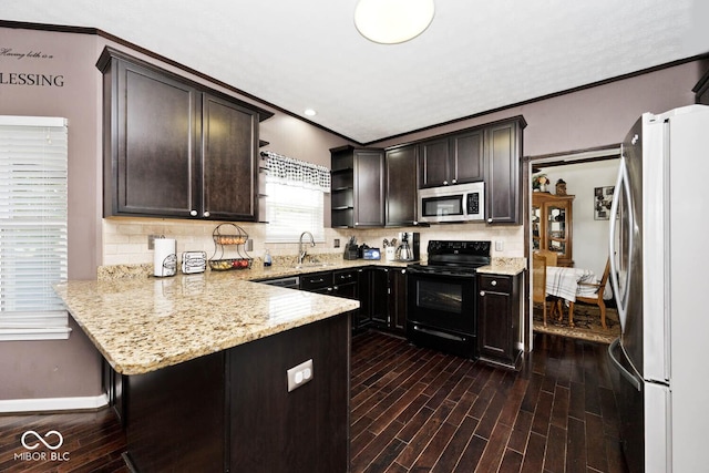 1093 Springwater Dr, Greenwood, IN 46143 - kitchen featuring freestanding refrigerator, stainless steel microwave, electric range, dark brown cabinetry, and open shelves