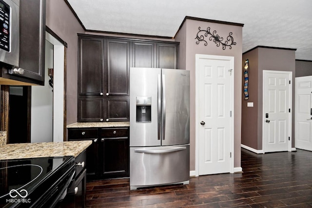 1093 Springwater Dr, Greenwood, IN 46143 - kitchen featuring appliances with stainless steel finishes, dark wood-style flooring, light stone countertops, dark brown cabinets, and crown molding