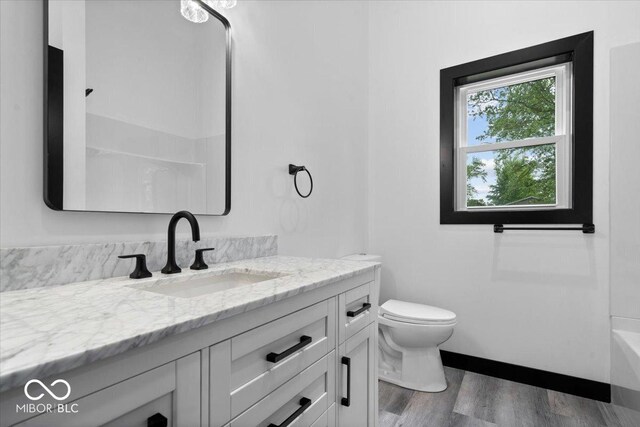 8237 S 100 E, Markleville, IN 46056 - full bathroom featuring vanity, wood finished floors, and a tub