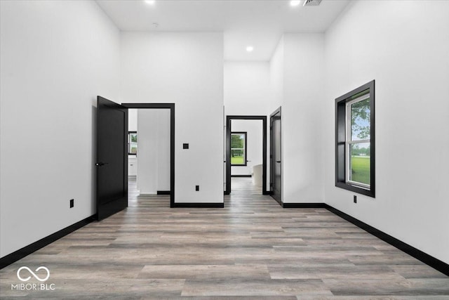 8237 S 100 E, Markleville, IN 46056 - spare room featuring a towering ceiling, recessed lighting, and wood finished floors