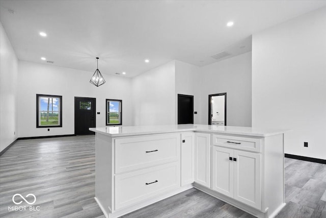8237 S 100 E, Markleville, IN 46056 - kitchen with open floor plan, light wood finished floors, light countertops, white cabinetry, and recessed lighting
