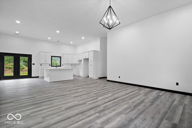 8237 S 100 E, Markleville, IN 46056 - unfurnished living room featuring recessed lighting, light wood-type flooring, and a chandelier