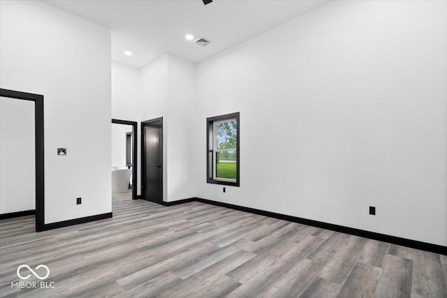 8237 S 100 E, Markleville, IN 46056 - unfurnished bedroom with wood finished floors, recessed lighting, and a high ceiling
