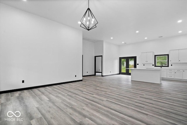 8237 S 100 E, Markleville, IN 46056 - unfurnished living room with recessed lighting, light wood-style flooring, and a chandelier