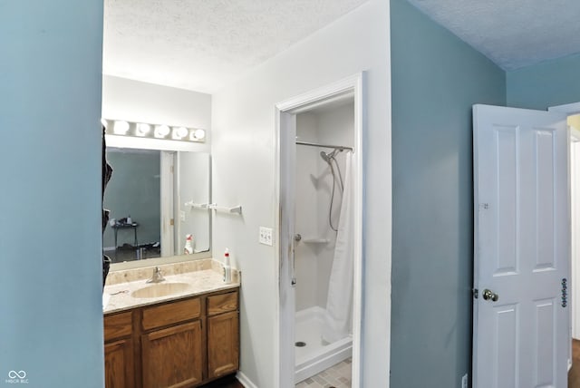 12316 Winding Creek Cir, Indianapolis, IN 46236 - bathroom with vanity, a textured ceiling, and a shower stall