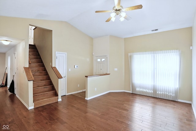 12316 Winding Creek Cir, Indianapolis, IN 46236 - unfurnished living room with vaulted ceiling, wood finished floors, a ceiling fan, and stairs